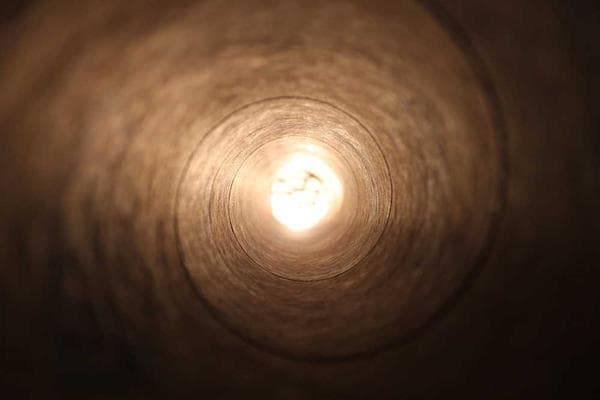 A large pot of biryani being served.